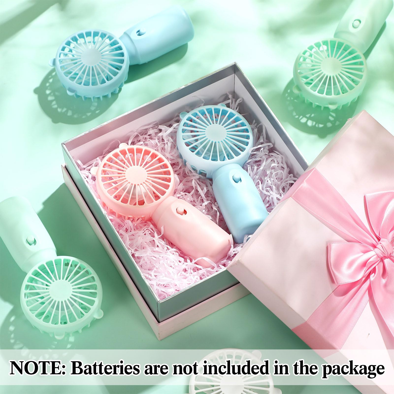 Battery operated portable fans in bulk, ideal for personal cooling during makeup and eyelash care
