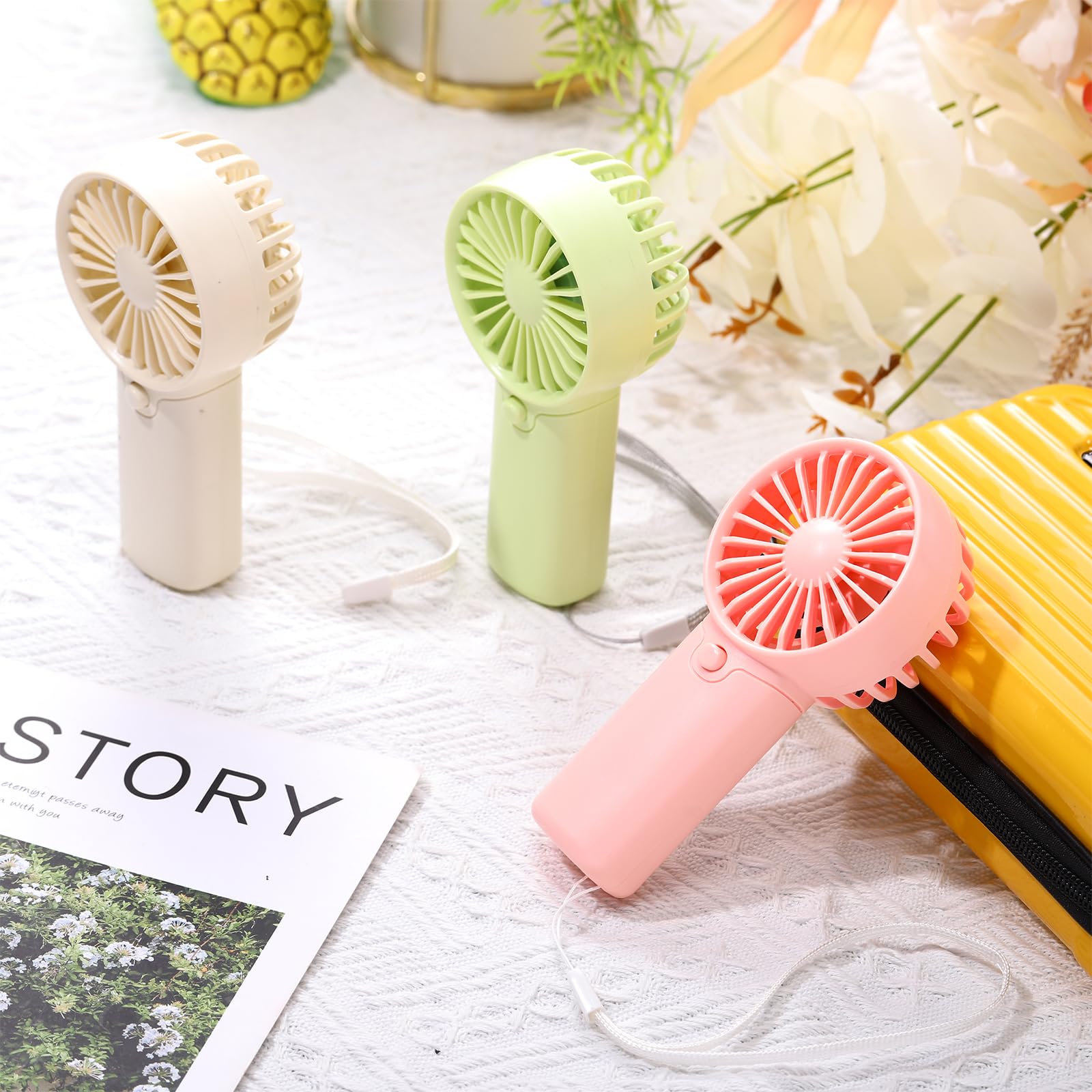 Compact and lightweight handheld fans, perfect for summer travel and outdoor use