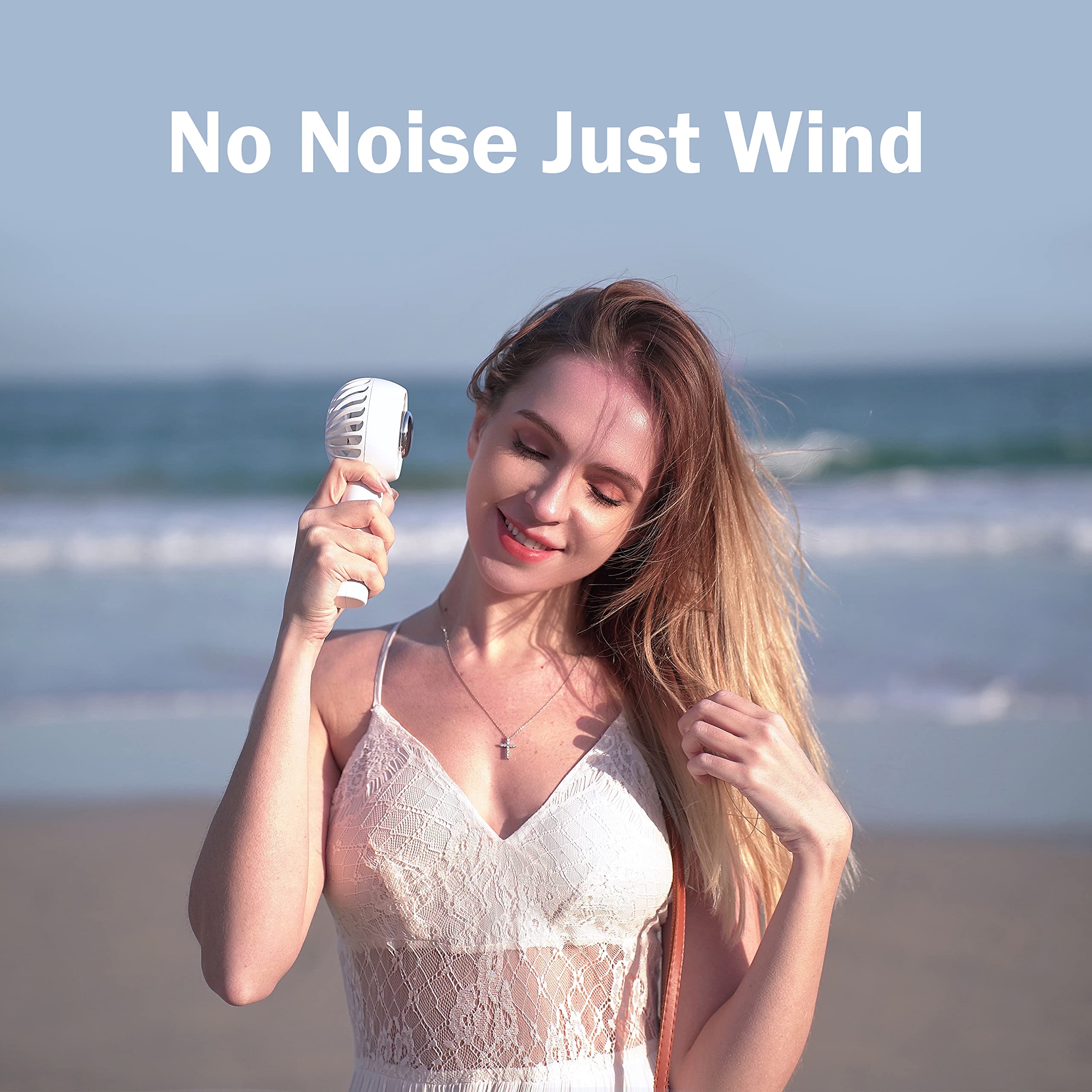 Handheld air conditioning fan with refrigerating pad, ideal for instant personal cooling on hot days