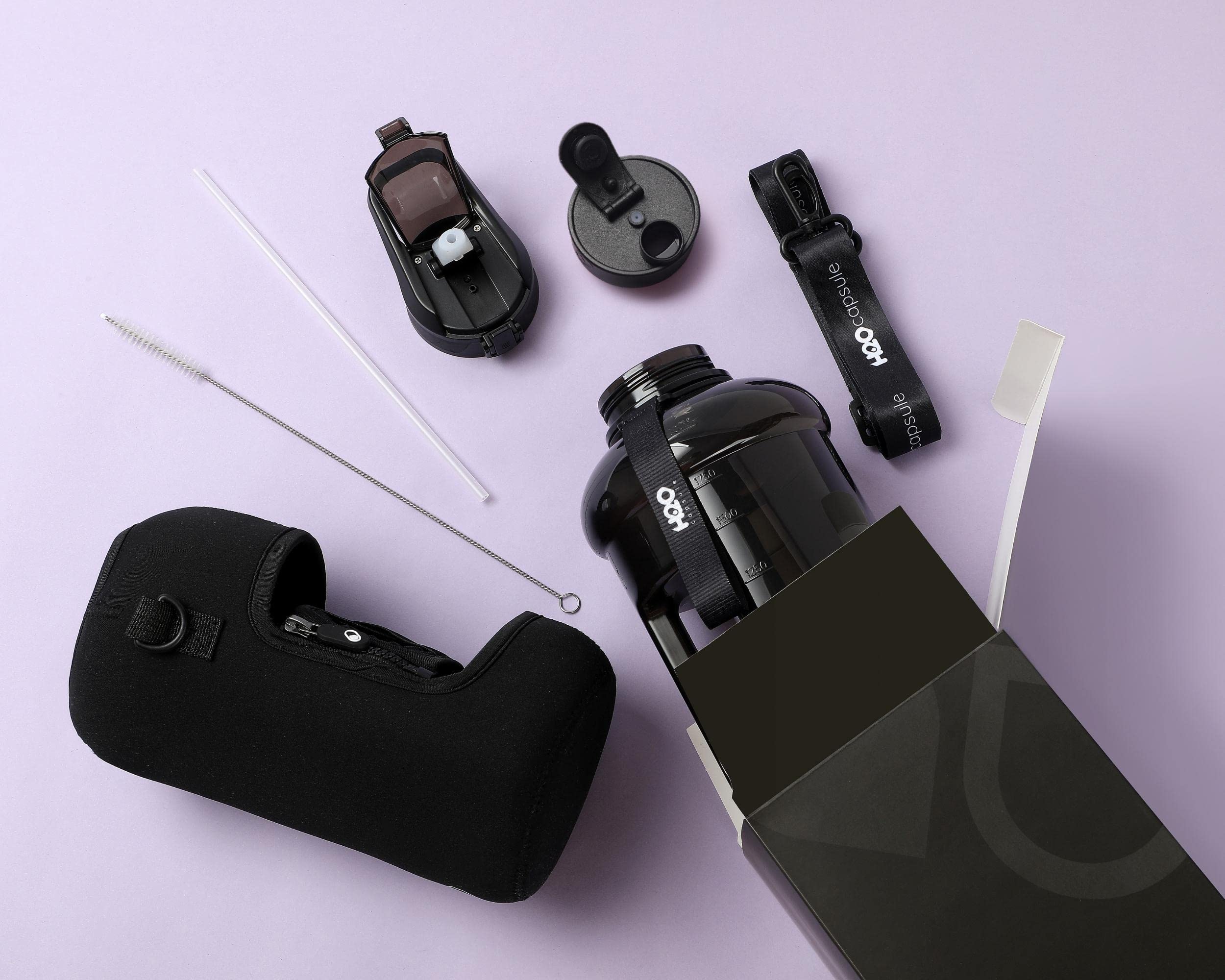 H2O Capsule 2.2L Half Gallon Water Bottle With Storage Sleeve And Covered Straw Lid