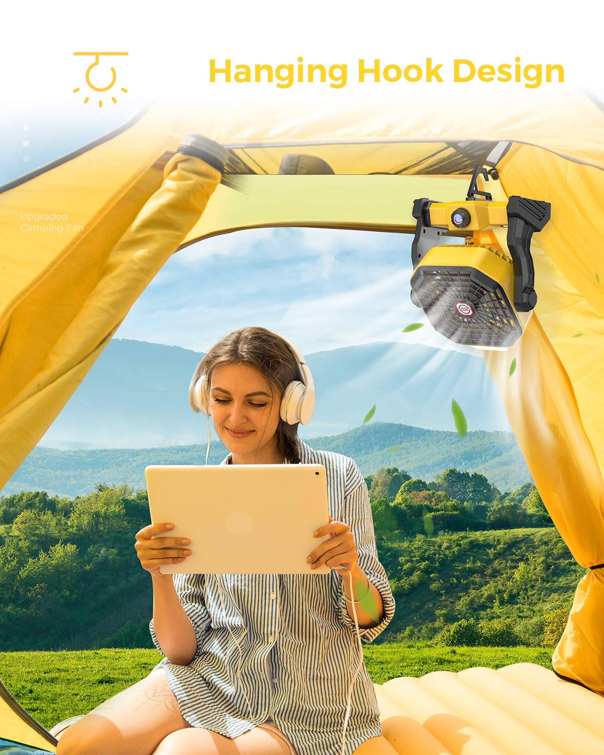 Camping fan placed on a picnic table, providing cooling and lighting during an outdoor gathering